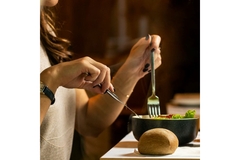 Image Woman dining a vegetarian diet at a restaurant